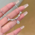 Nymph teardrop necklace sewn with an elegant piece of lace