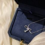 A modern necklace in an elegant bow style